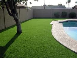 artificial grass installed by a pool side