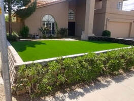 artificial turf installed in a lawn